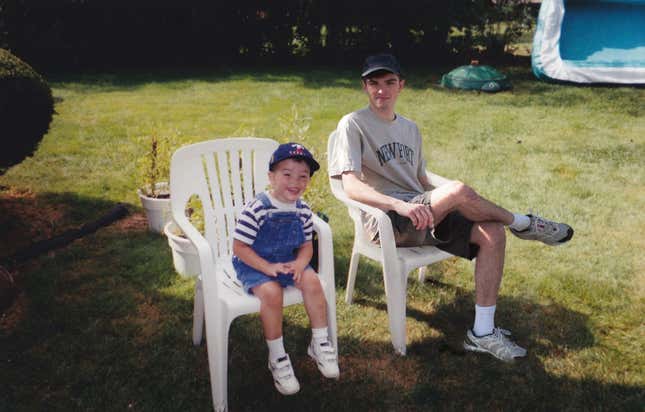 Young Nickerson and adult Nickerson sit next to each other on lawn chairs.