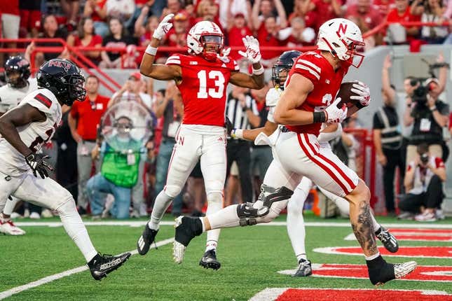 Sep 16, 2023; Lincoln, Nebraska, USA; Nebraska Cornhuskers tight end Thomas Fidone II (24) scores against the Northern Illinois Huskies during the second quarter at Memorial Stadium.