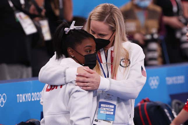 Simone Biles of Team United States is embraced by coach Cecile Landi during the Women’s Team Final on day four of the Tokyo 2020 Olympic Games at Ariake Gymnastics Centre on July 27, 2021 in Tokyo, Japan. 
