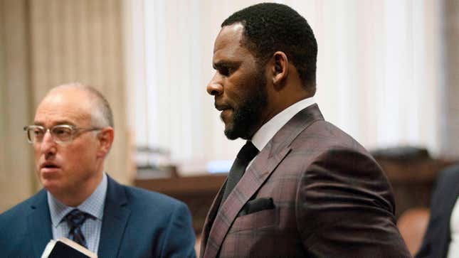  R. Kelly, center, appears at a hearing before Judge Lawrence Flood at Leighton Criminal Court Building, on June 26, 2019.