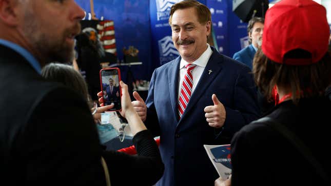 Businessman and election conspiracy theorist Mike Lindell poses for photos with thumbs-up during the Conservative Political Action Conference (CPAC) at Gaylord National Resort Hotel And Convention Center on March 02, 2023 in National Harbor, Maryland.