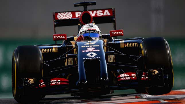 Romain Grosjean drives his 2014, black and gold Lotus Renault F1 car. 