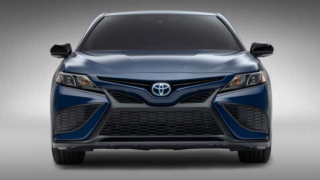 A photo of the front end on a blue Toyota Camry sedan. 