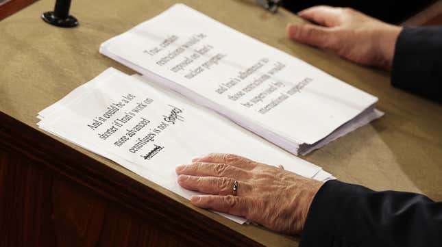 Israeli Prime Minister Benjamin Netanyahu holds a copy of his speech with hand written edits.