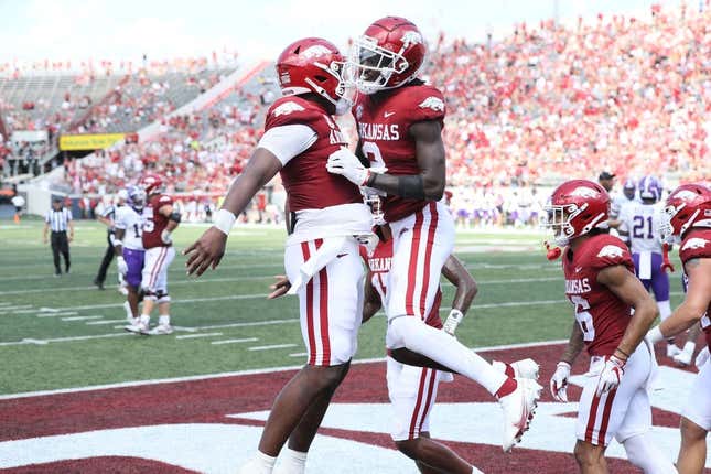 Sep 2, 2023; Little Rock, Arkansas, USA; Arkansas Razorbacks quarterback KJ Jefferson (1) and wide receiver Andrew Armstrong (2) celebrate after a touchdown against the Western Carolina Catamounts at War Memorial Stadium. Arkansas won 56-13.