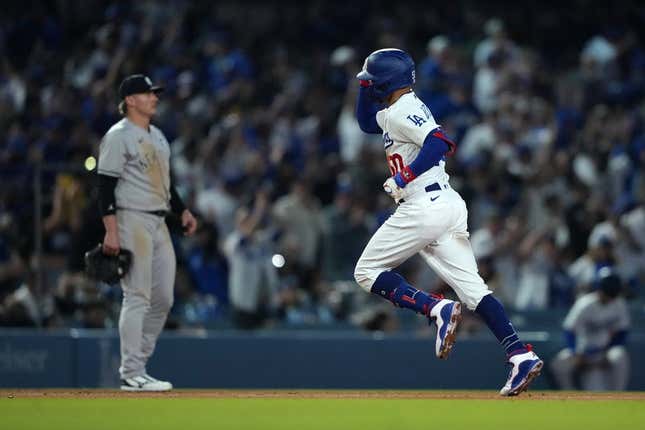 Jun 2, 2023; Los Angeles, California, USA; Los Angeles Dodgers right fielder Mookie Betts (50) rounds the bases after hitting a home run in the sixth inning against the New York Yankees  at Dodger Stadium.
