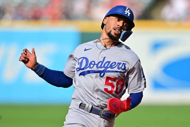 Aug 24, 2023; Cleveland, Ohio, USA; Los Angeles Dodgers right fielder Mookie Betts (50) advances to third on double hit by first baseman Freddie Freeman (5) during the third inning against the Cleveland Guardians at Progressive Field.