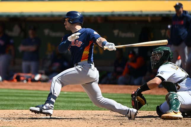 May 27, 2023; Oakland, California, USA; Houston Astros infielder Alex Bregman (2) hits an RBI double against the Oakland Athletics during the eighth inning at Oakland-Alameda County Coliseum.