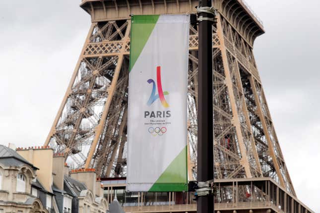The Eiffel Tower with a banner of the 2024 Olympics