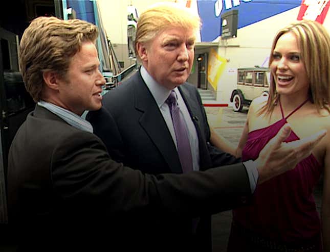 In this 2005 frame from video, Donald Trump (center) prepares for an appearance on ‘Days of Our Lives’ with actress Arianne Zucker, accompanied to the set by Access Hollywood host Billy Bush (left).