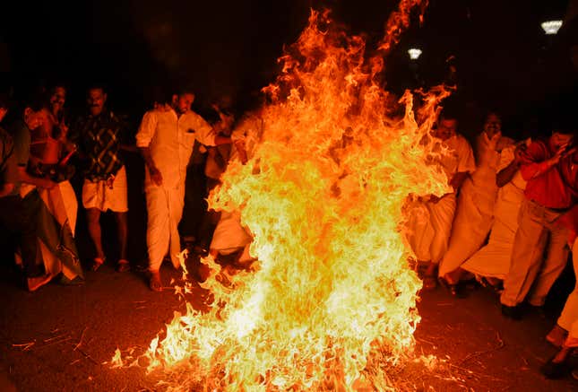 Congress party activists burn an effigy of chief minister Vijayan in Thiruvananthapuram, Kerala.