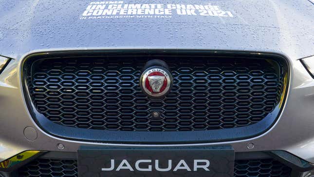 The grill of a Jaguar SUV with COP26 branding.