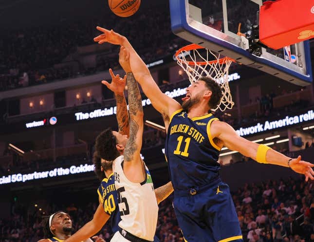 Feb 26, 2023; San Francisco, California, USA; Golden State Warriors guard Klay Thompson (11) defends the shot by Minnesota Timberwolves guard Austin Rivers (25) during the first quarter at Chase Center.