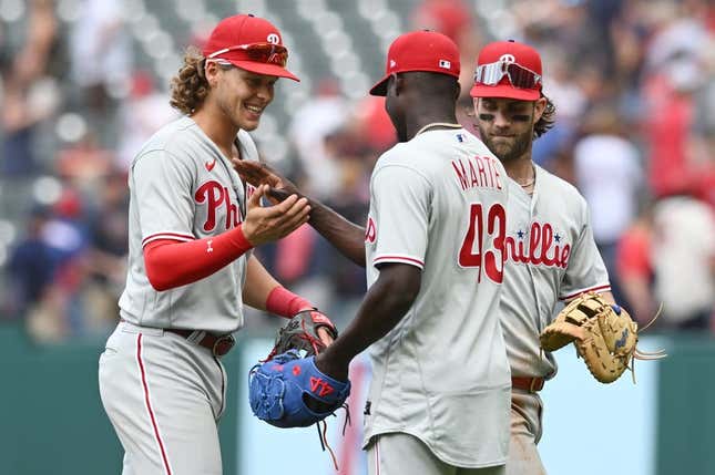 Jul 23, 2023; Cleveland, Ohio, USA; Philadelphia Phillies relief pitcher Yunior Marte (43) celebrates with third baseman Alec Bohm (28) and Bryce Harper (3) after the Phillies beat the Cleveland Guardians at Progressive Field.