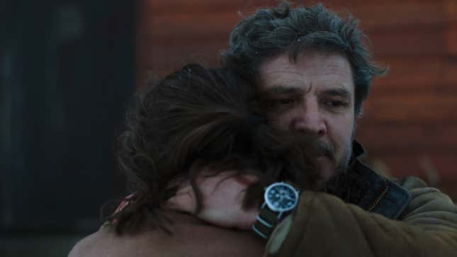 Joel is seen holding Ellie as she cries.