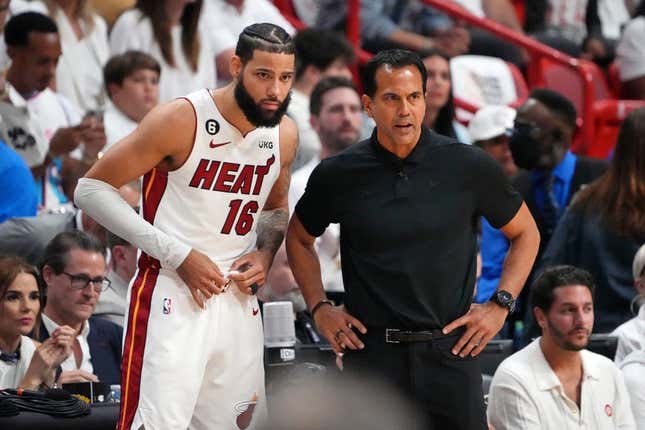Jun 9, 2023; Miami, Florida, USA; Miami Heat forward Caleb Martin (16) talks with head coach Erik Spoelstra during a pause in play against the Denver Nuggets during the first quarter in game four of the 2023 NBA Finals at Kaseya Center.