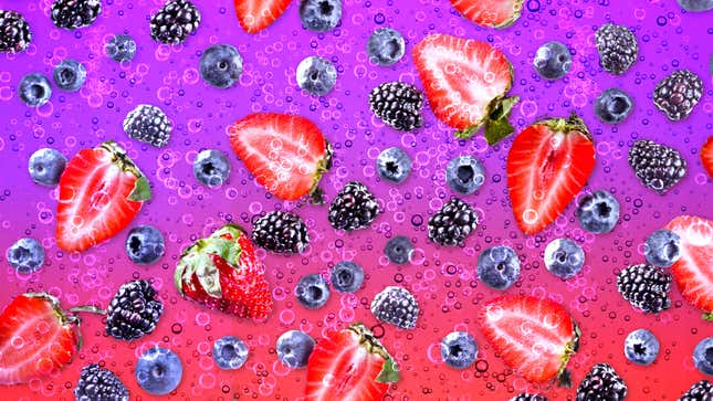Various berries on a fizzy pink and purple background