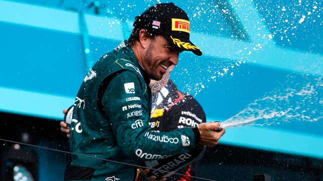 Third placed Fernando Alonso of Spain and Aston Martin F1 Team celebrates on the podium during the F1 Grand Prix of Miami at Miami International Autodrome on May 07, 2023 in Miami, Florida