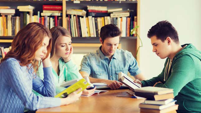 Group of students studying in library 