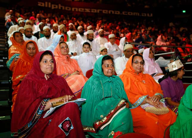 A group of attendees wears a traditional Muslim outfit in the audience in Sydney.