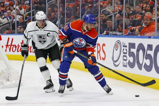 Mar 30, 2023; Edmonton, Alberta, CAN; Edmonton Oilers forward Evander Kane (91) protects the puck from Los Angeles Kings forward Anze Kopitar (11) during the third period at Rogers Place.