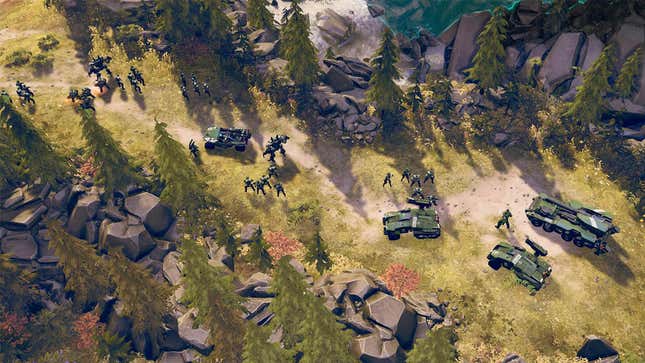 A screenshot of Halo Wars 2 featuring a large group of UNSC troop hanging out in a lush forest. 