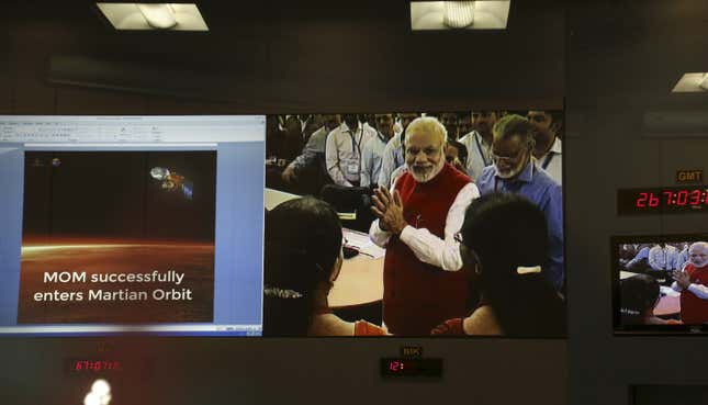 TV grabs show prime minister Narendra Modi greeting Indian Space Research Organisation scientists in Bangalore.