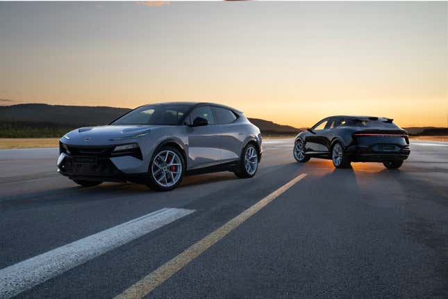 A pair of 2024 Lotus Eletre Rs are parked on a runway at sunset