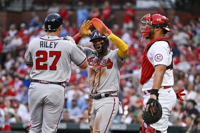 Apr 4, 2023; St. Louis, Missouri, USA;  Atlanta Braves third baseman Austin Riley (27) celebrates with right fielder Ronald Acuna Jr. (13) after hitting a two run home run against the St. Louis Cardinals during the first inning at Busch Stadium.