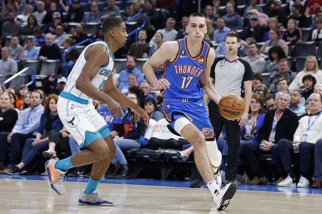 Mar 28, 2023; Oklahoma City, Oklahoma, USA; Oklahoma City Thunder forward Aleksej Pokusevski (17) dribbles the ball against Charlotte Hornets guard Theo Maledon (9) during the second half at Paycom Center. Charlotte defeated Oklahoma City 137-134.