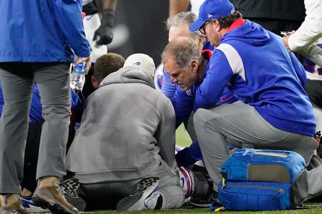 Buffalo Bills’ Damar Hamlin is examined during the first half of an NFL football game against the Cincinnati Bengals, Monday, Jan. 2, 2023, in Cincinnati. The game has been postponed after Buffalo Bills’ Damar Hamlin collapsed, NFL Commissioner Roger Goodell announced.