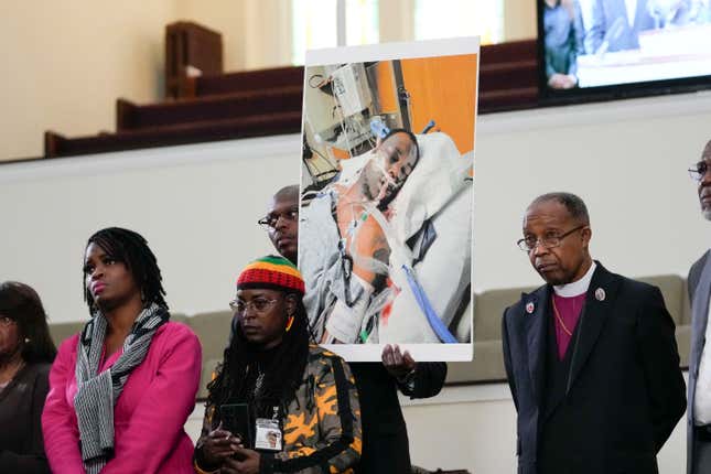 Family members and supporters hold a photograph of Tyre Nichols at a news conference in Memphis, Tenn., Jan. 23, 2023. 