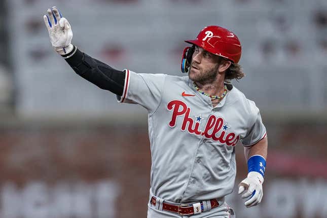 Sep 18, 2023; Cumberland, Georgia, USA; Philadelphia Phillies first baseman Bryce Harper (3) reacts as he runs the bases after hitting a home run against the Atlanta Braves during the third inning at Truist Park.