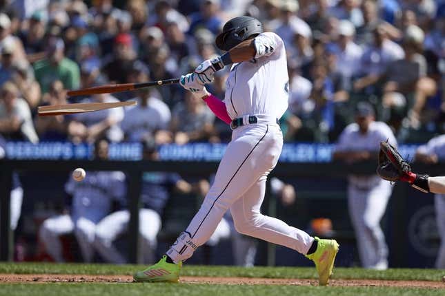 Aug 2, 2023; Seattle, Washington, USA; Seattle Mariners  Julio Rodriguez breaks his bat hitting an RBI single against the Boston Red Sox suring the seventh inning at T-Mobile Park.