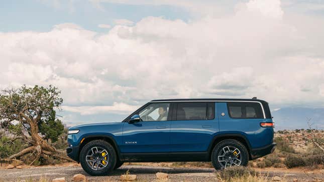 A photo of a the side of a Rivian R1S electric SUV. 