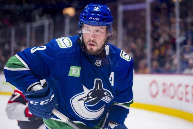 Mar 11, 2023; Vancouver, British Columbia, CAN; Vancouver Canucks forward J.T. Miller (9) looks for the loose puck against the Ottawa Senators in the third period at Rogers Arena. Canucks won 5-2.