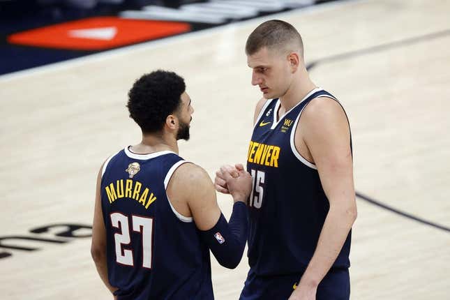 Jun 4, 2023; Denver, CO, USA; Denver Nuggets center Nikola Jokic (15) and guard Jamal Murray (27) react in the second quarter against the Miami Heat in game two of the 2023 NBA Finals at Ball Arena.