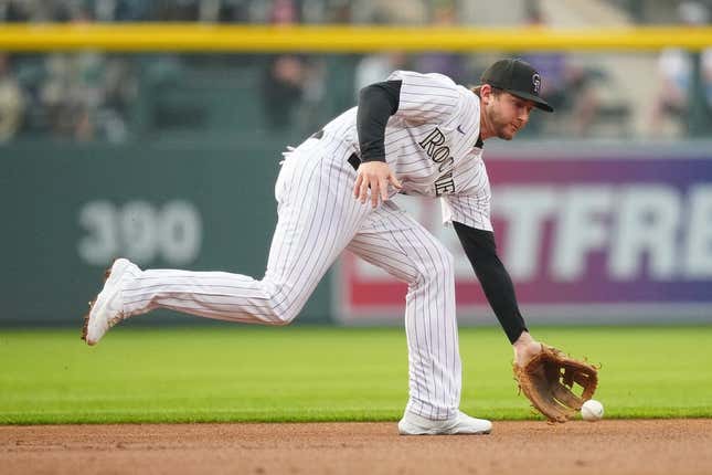 May 23, 2023;  Denver, Colorado, USA;  Colorado Rockies second baseman Ryan McMahon (24) throws the ball during the first inning against the Miami Marlins at Coors Field.