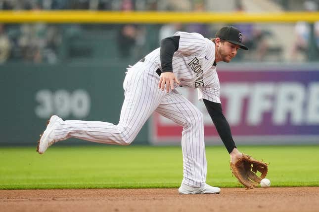 May 23, 2023; Denver, CO, USA; Colorado Rockies second baseman Ryan McMahon (24) catches the ball during the first inning against the Miami Marlins at Coors Field.