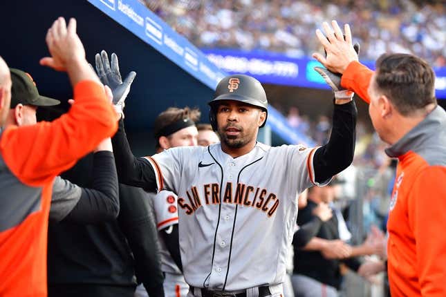Jun 17, 2023; Los Angeles, California, USA; San Francisco Giants first baseman LaMonte Wade Jr. (31) is greeted after hitting a three run home run against the Los Angeles Dodgers during the fifth inning at Dodger Stadium.