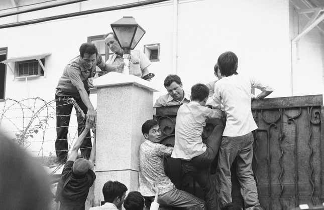 Scaling the US embassy gates.