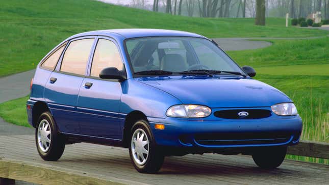 A photo of a blue Ford Aspire coupe. 
