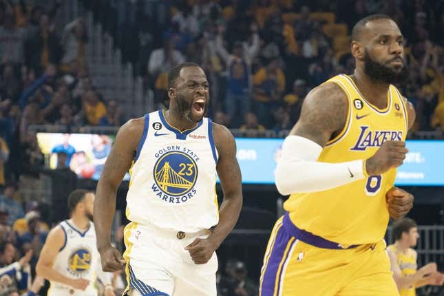 May 10, 2023; San Francisco, California, USA; Golden State Warriors forward Draymond Green (23) celebrates against Los Angeles Lakers forward LeBron James (6) during the first quarter in game five of the 2023 NBA playoffs conference semifinals round at Chase Center.