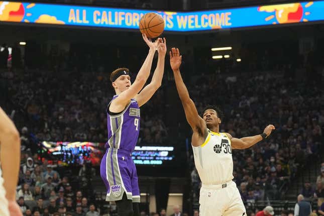 Mar 25, 2023; Sacramento, California, USA; Sacramento Kings guard Kevin Huerter (9) shoots against Utah Jazz guard Ochai Agbaji (30) during the first quarter at Golden 1 Center.