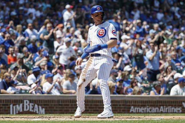 May 5, 2023; Chicago, Illinois, USA; Chicago Cubs second baseman Nico Hoerner (2) scores against the Miami Marlins during the first inning at Wrigley Field.