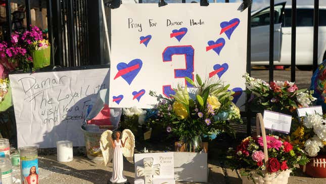 Fans hold a vigil for Damar Hamlin outside his hospital in Cincinnati.