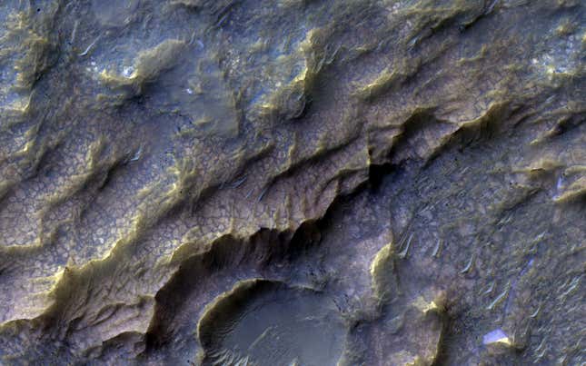 The 'dragon scale' pattern, seen here from the MRO, results from water interacting with rock.