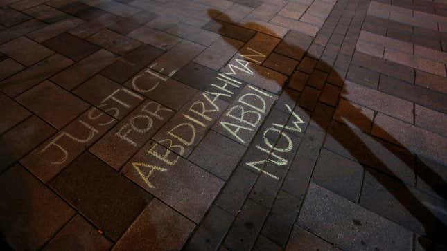 Protesters in Ottawa held a vigil for Abdirahman Abdi on July 26, a day after his death was announced.