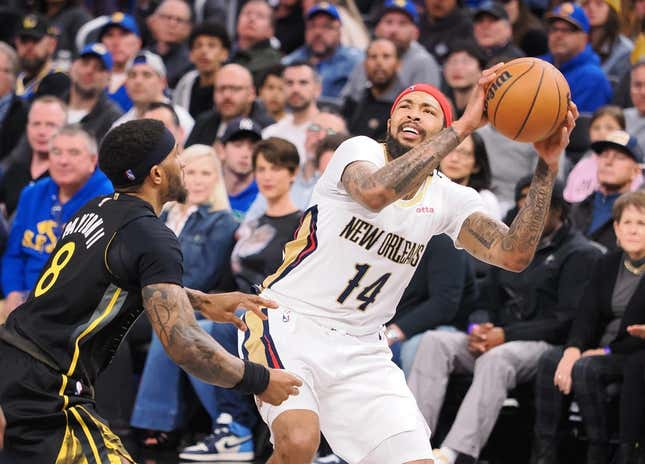 Mar 28, 2023; San Francisco, California, USA; New Orleans Pelicans small forward Brandon Ingram (14) looks to the basket against Golden State Warriors guard Gary Payton II (8) during the third quarter at Chase Center.