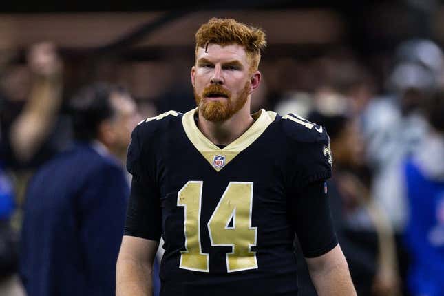 Jan 8, 2023; New Orleans, Louisiana, USA;  New Orleans Saints quarterback Andy Dalton (14) runs to the locker room after the game against the Carolina Panthers during the second half at Caesars Superdome.
